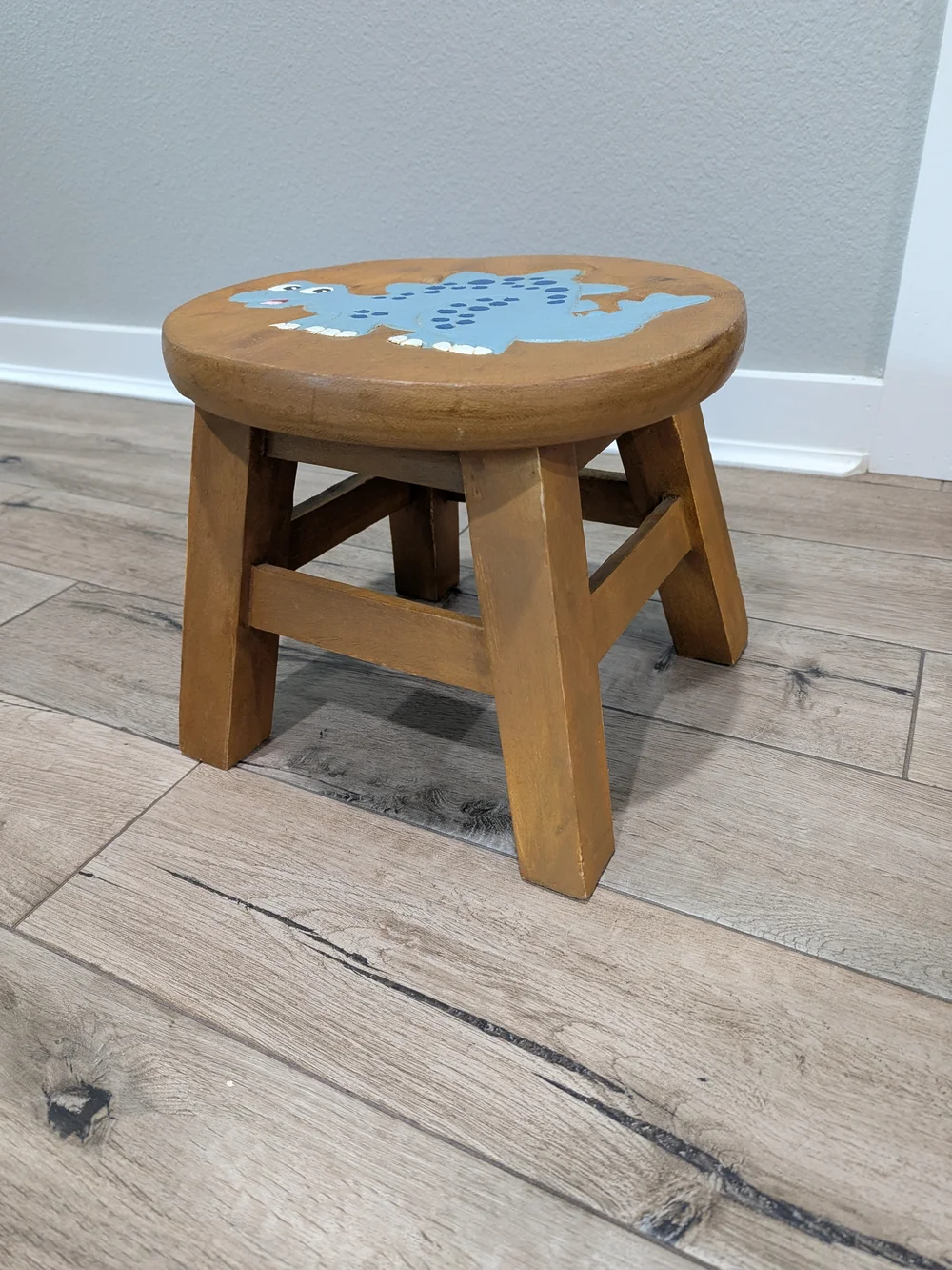 Carved Painted Brown Wooden Kids Stool with Blue Dinosaur